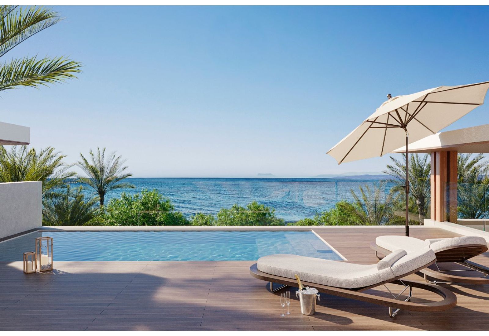 Luksusowy basen z widokiem na morze i leżakami
